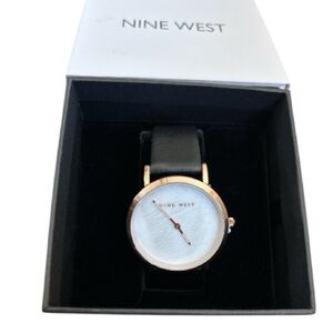 NINE WEST FELICITY WATCH, new,never worn
Rose gold and black, black leather band